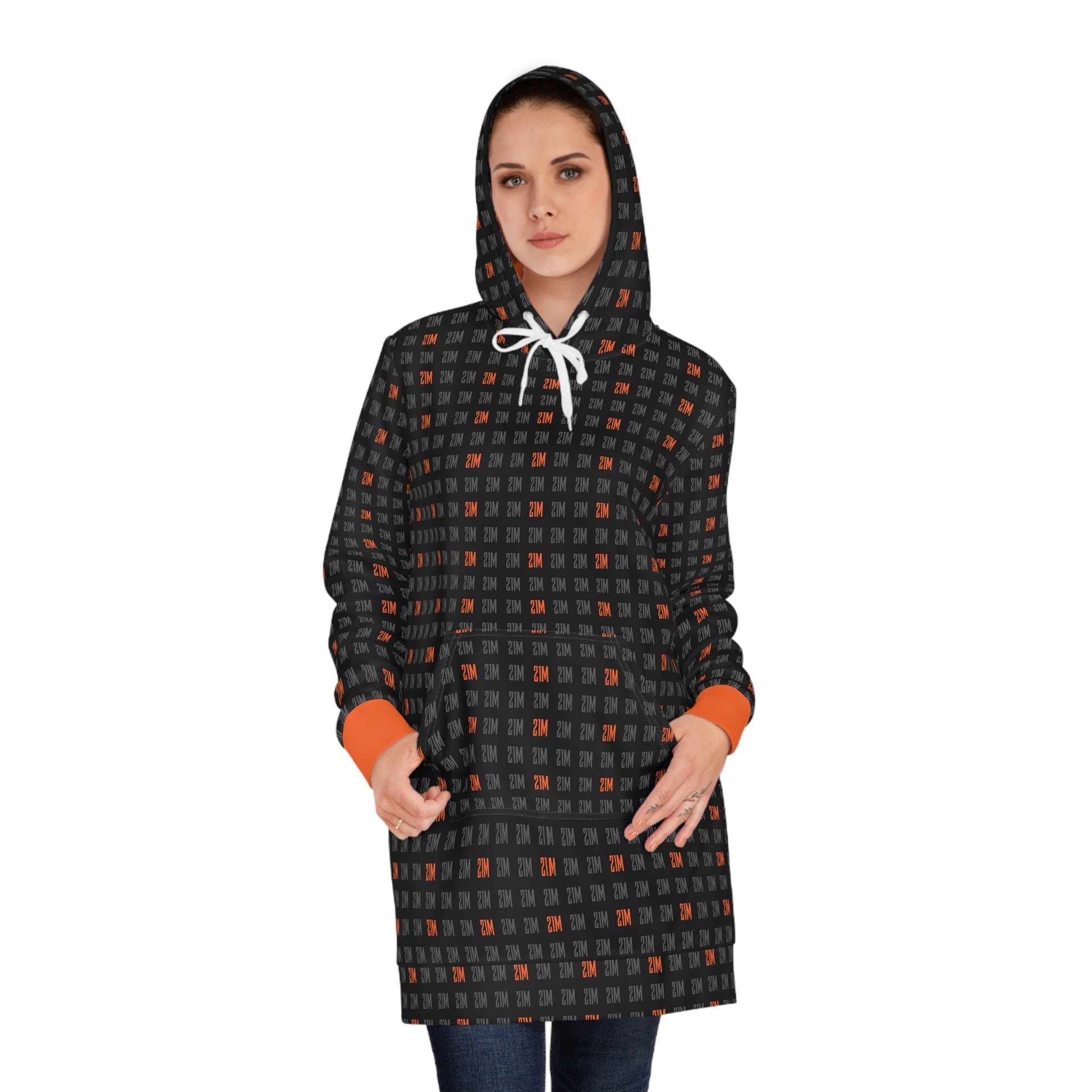 Woman wearing a black and orange 21 million patterned hooded coat on a white background