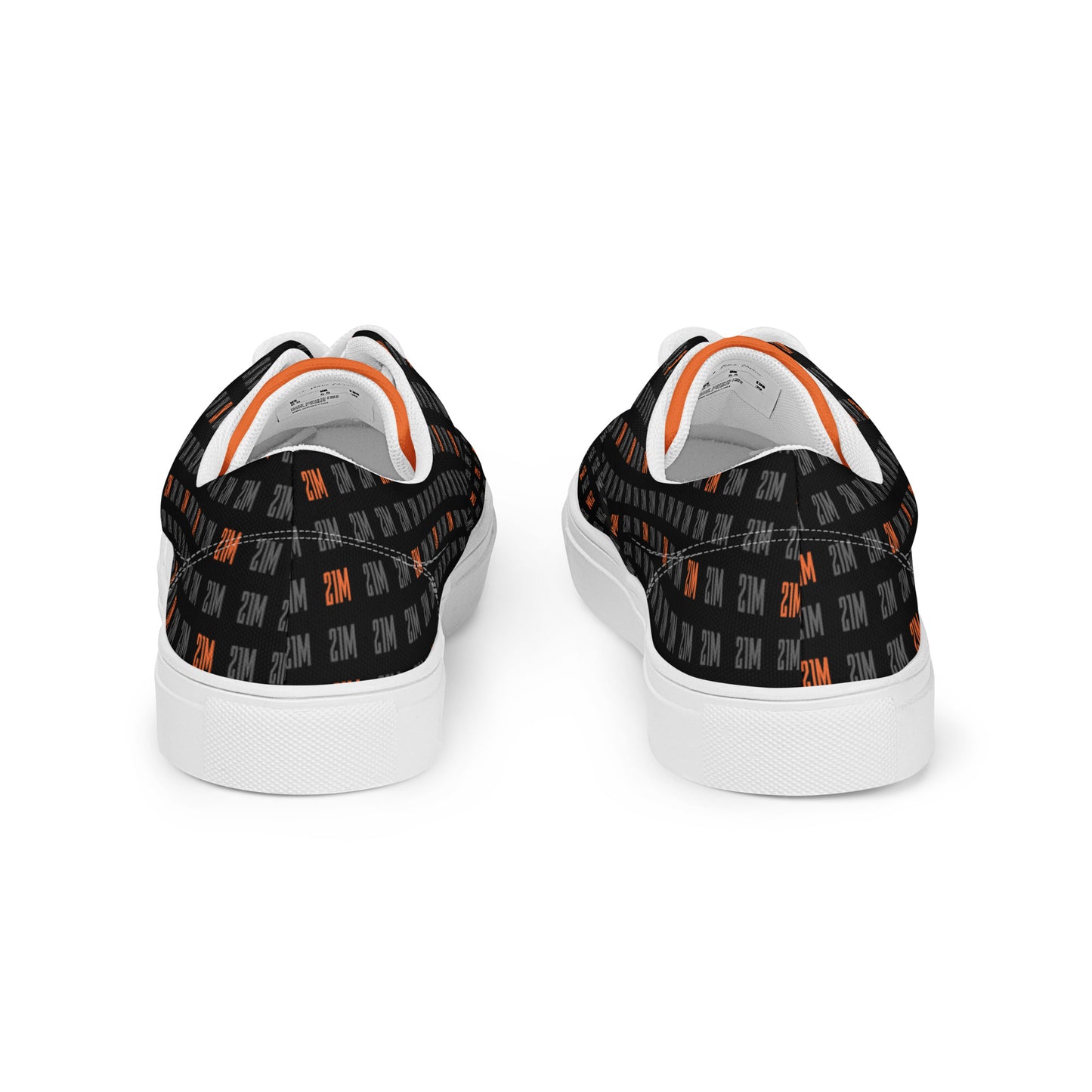 Black sneakers with orange patterns on a white background