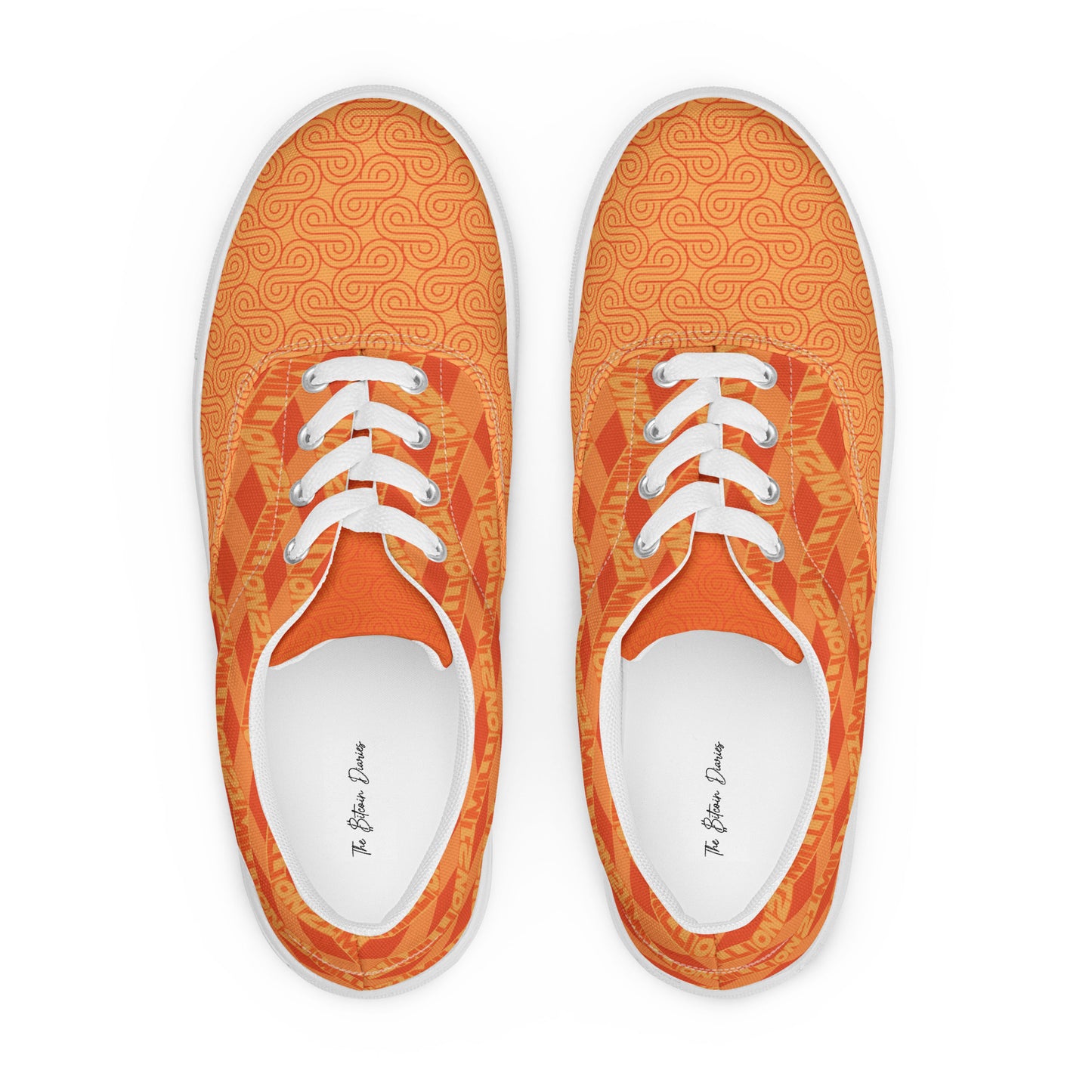 Pair of orange sneakers with white laces on a white background