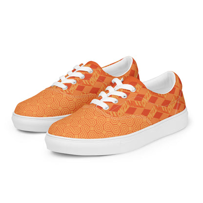 Orange patterned sneakers with white laces and soles on a white background