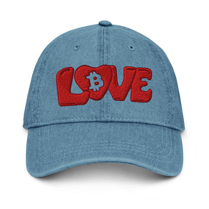 Blue denim cap with red 'LOVE' text and Bitcoin symbol on a white background