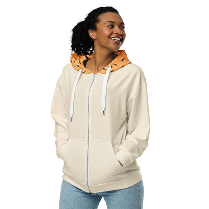 Woman wearing a beige hoodie with a colorful bitcoin bees hood on a white background