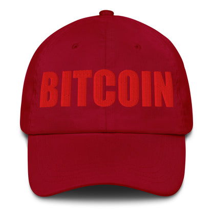Red cap with 'BITCOIN' text on a white background