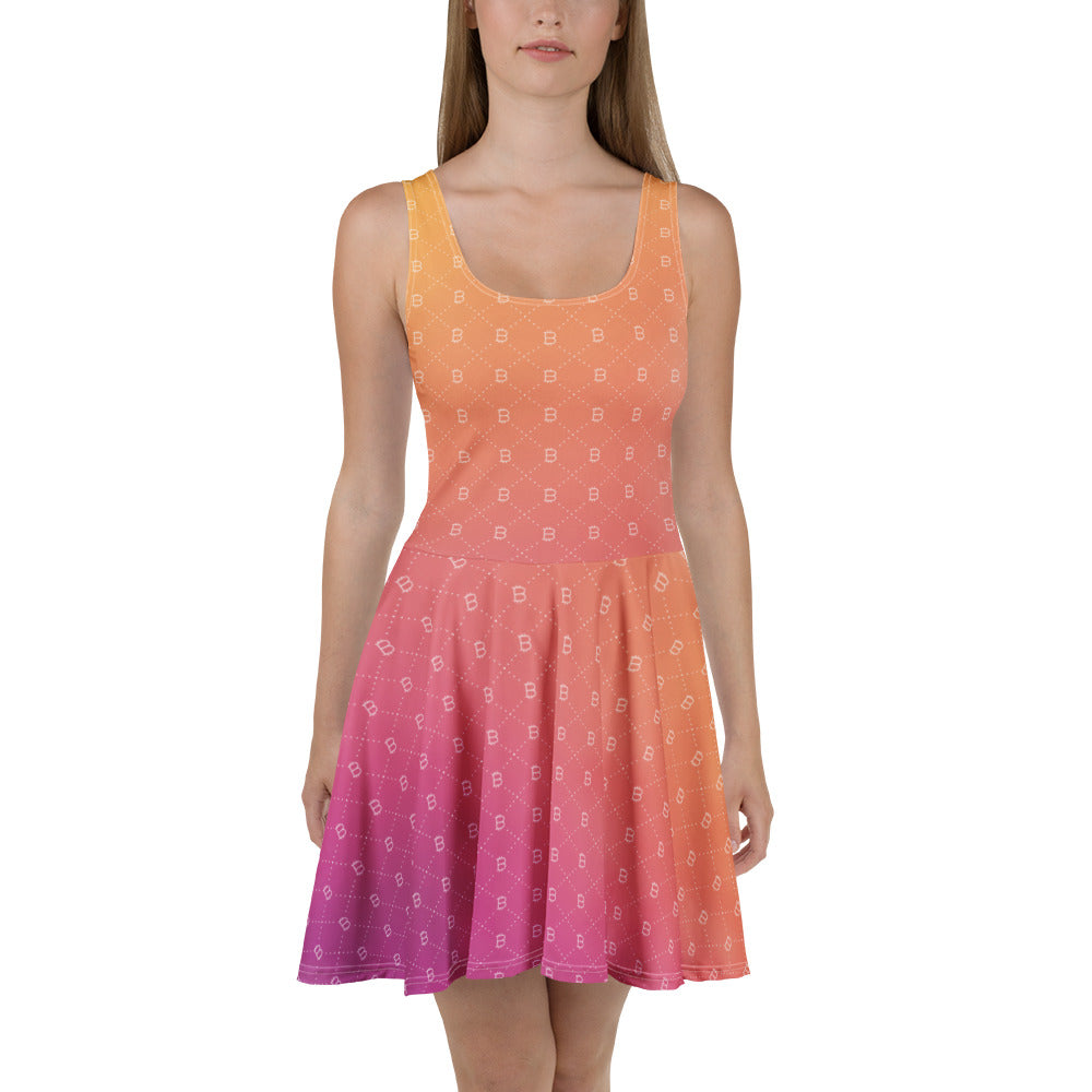 Woman wearing a sleeveless dress with a gradient bitcoin pattern from orange to pink on a white background