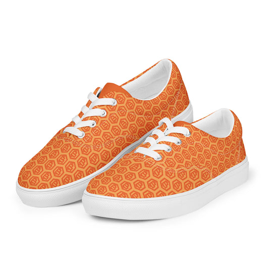 Orange sneakers with white bitcoin hexagonal pattern on a white background