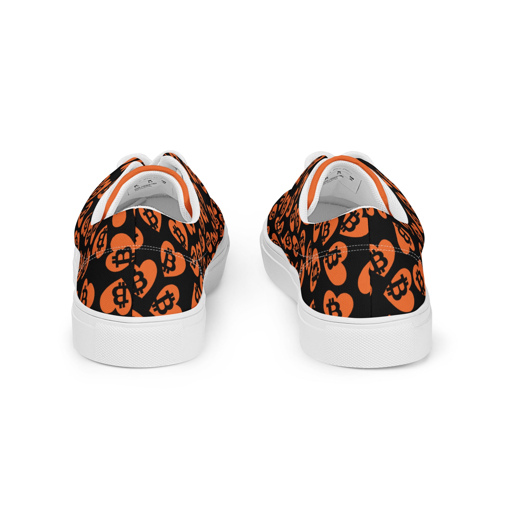 Black sneakers with orange pattern on a white background