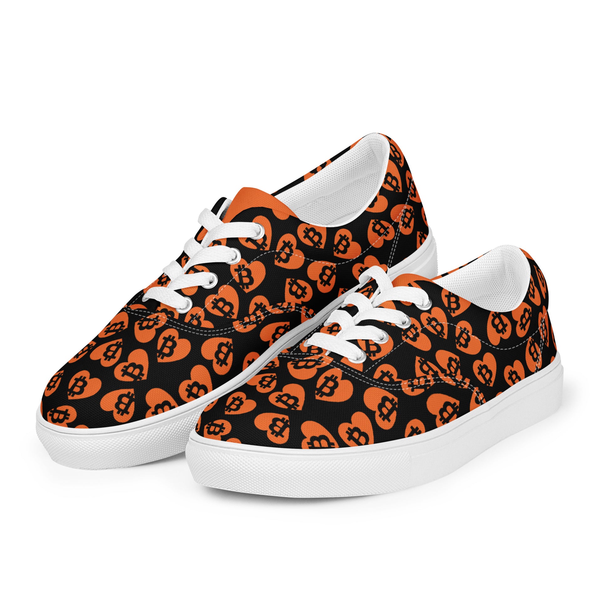 Pair of sneakers with orange and black bitcoin pattern on a white background