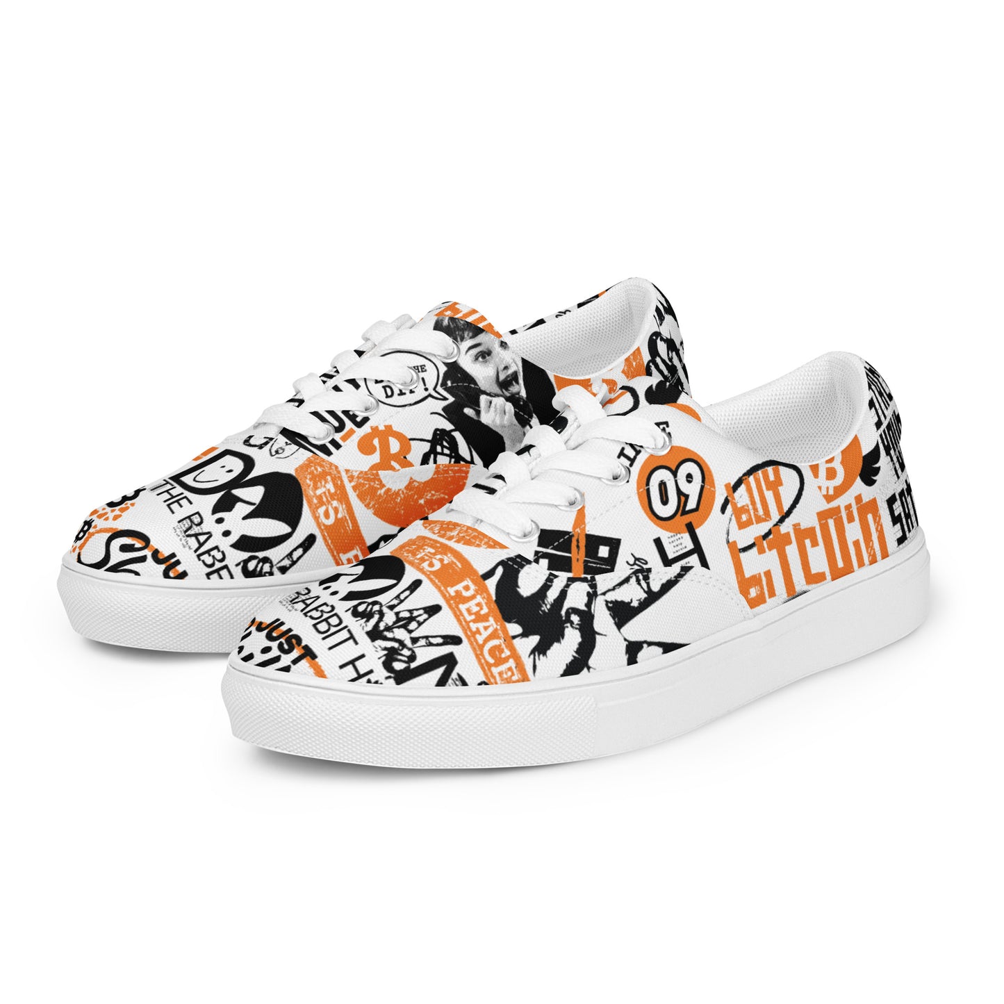 White bitcoin sneakers with black and orange graphics on a white background
