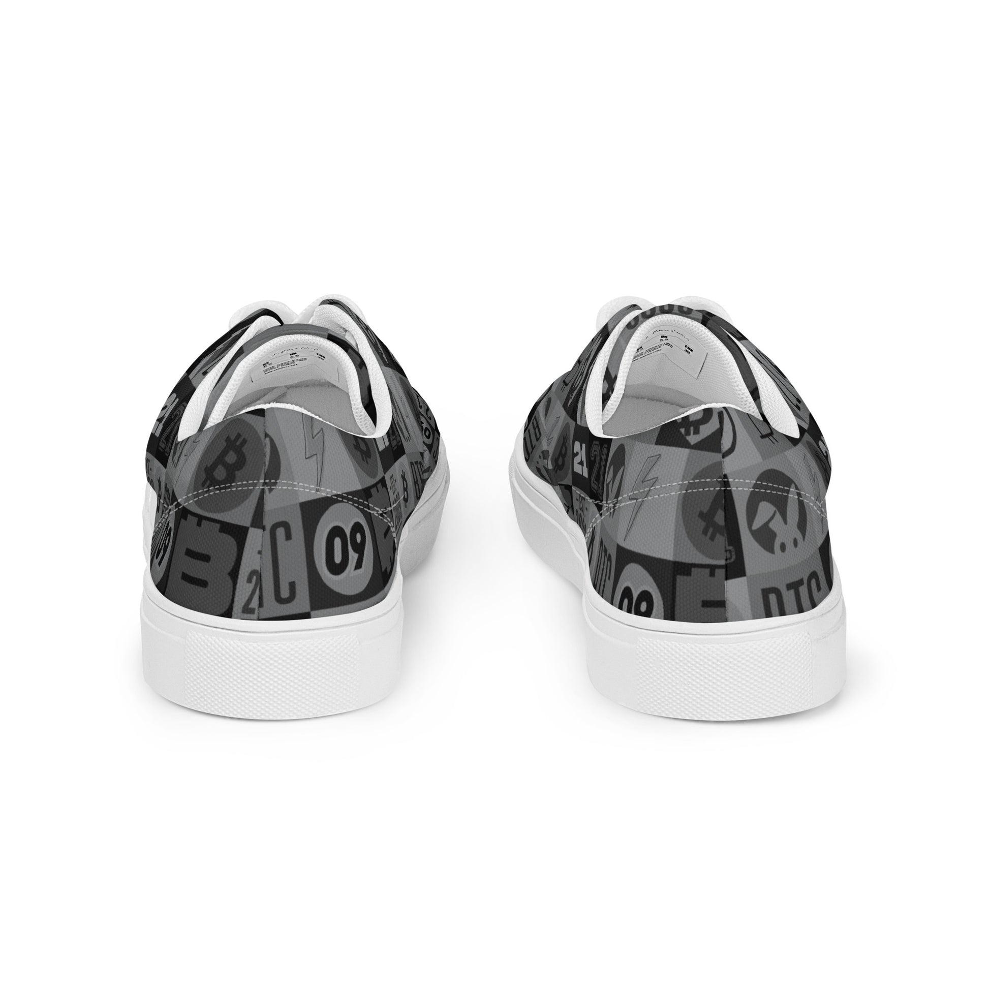 Black and white sneakers with graphic design on a white background