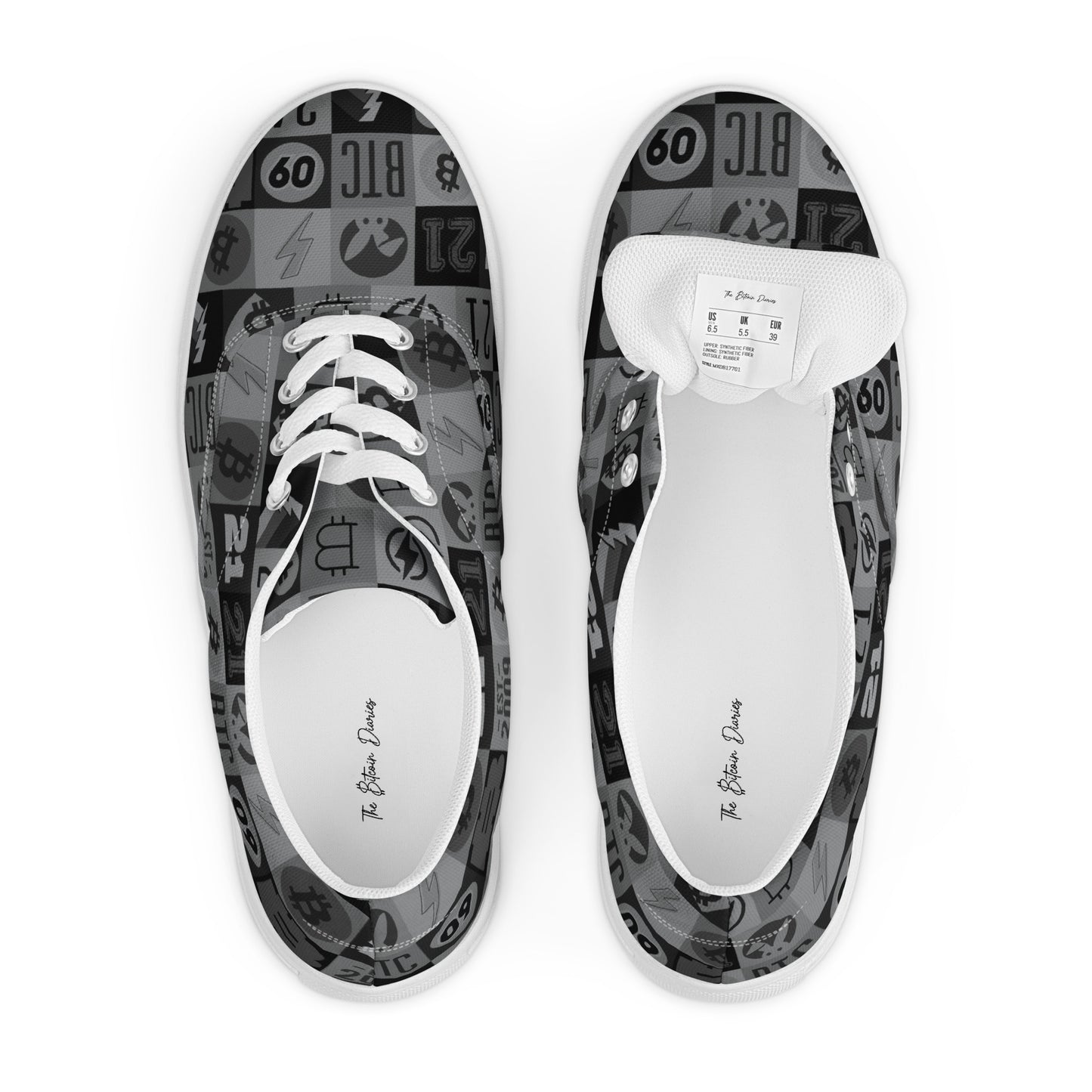 Pair of sneakers with black and white bitcoin patterned soles on a white background