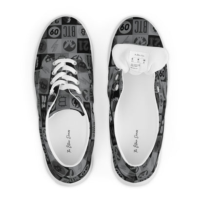 Pair of sneakers with black and white bitcoin patterned soles on a white background