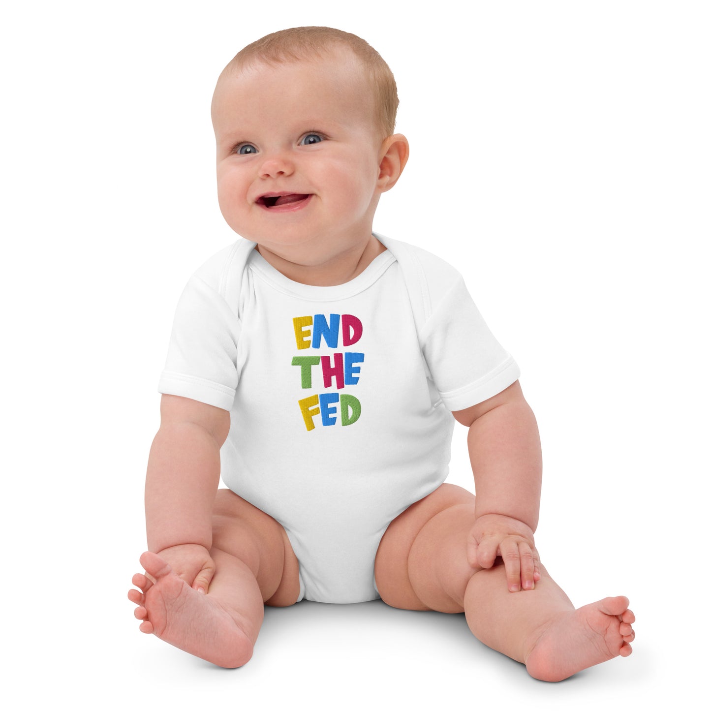 Baby wearing a white onesie with colorful 'end the fed' text on a white background