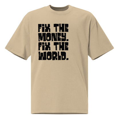 Beige t-shirt with black text 'FIX THE MONEY. FIX THE WORLD.' on a white background