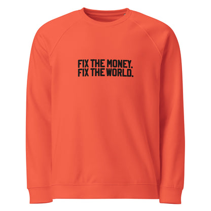 Orange sweatshirt with black text 'FIX THE MONEY. FIX THE WORLD.' on a white background