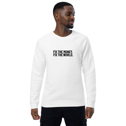Man wearing a white sweatshirt with text 'FIX THE MONEY, FIX THE WORLD' on a white background