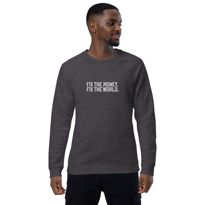 Man wearing a dark gray sweatshirt with fix the money fix the world. text on a white background