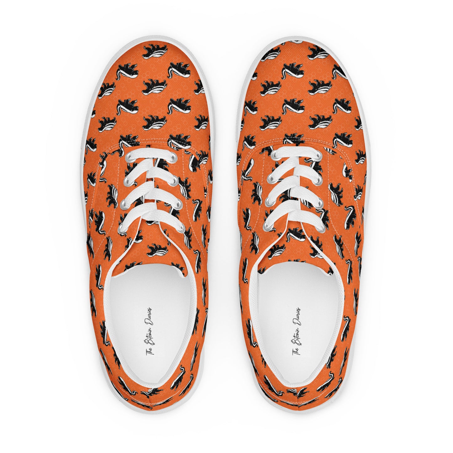 Orange sneakers with black and white honey badger pattern on a white background