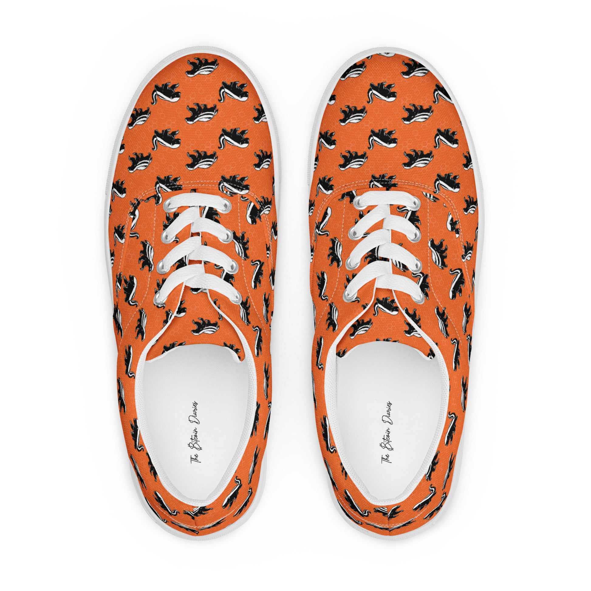 Orange sneakers with black and white honey badger pattern on a white background