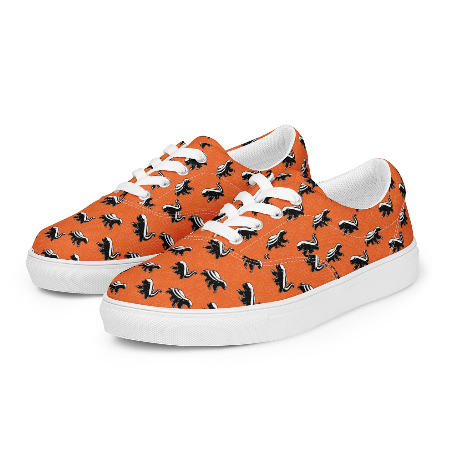 Orange sneakers with honey badger black and white pattern on a white background