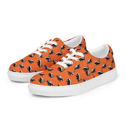 Orange sneakers with honey badger black and white pattern on a white background