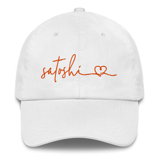 White cap with 'satoshi' embroidered in orange on a white background