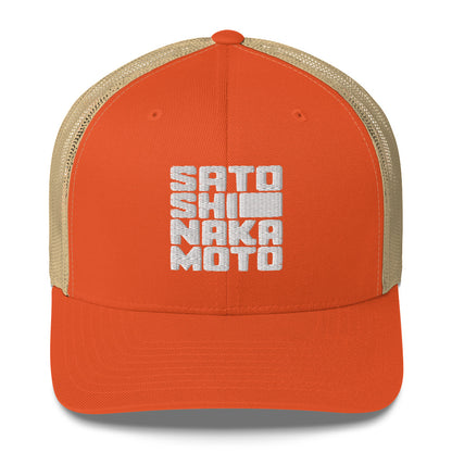 Orange cap with beige mesh back and white text satoshi nakamoto on a white background