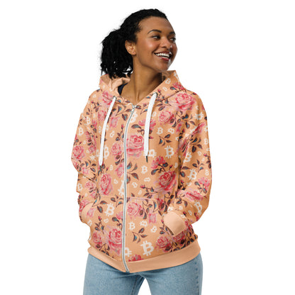 Woman wearing a floral-patterned bitcoin hoodie on a white background
