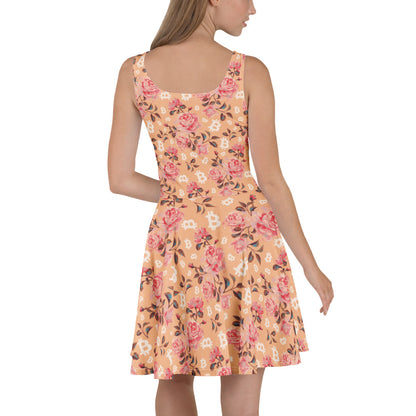 Woman wearing a peach floral dress with bitcoin symbols on a white background