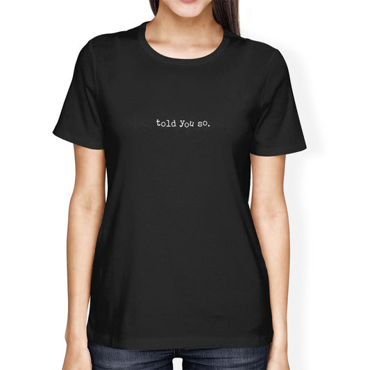 Black t-shirt with 'told you so' text worn by a person on a white background